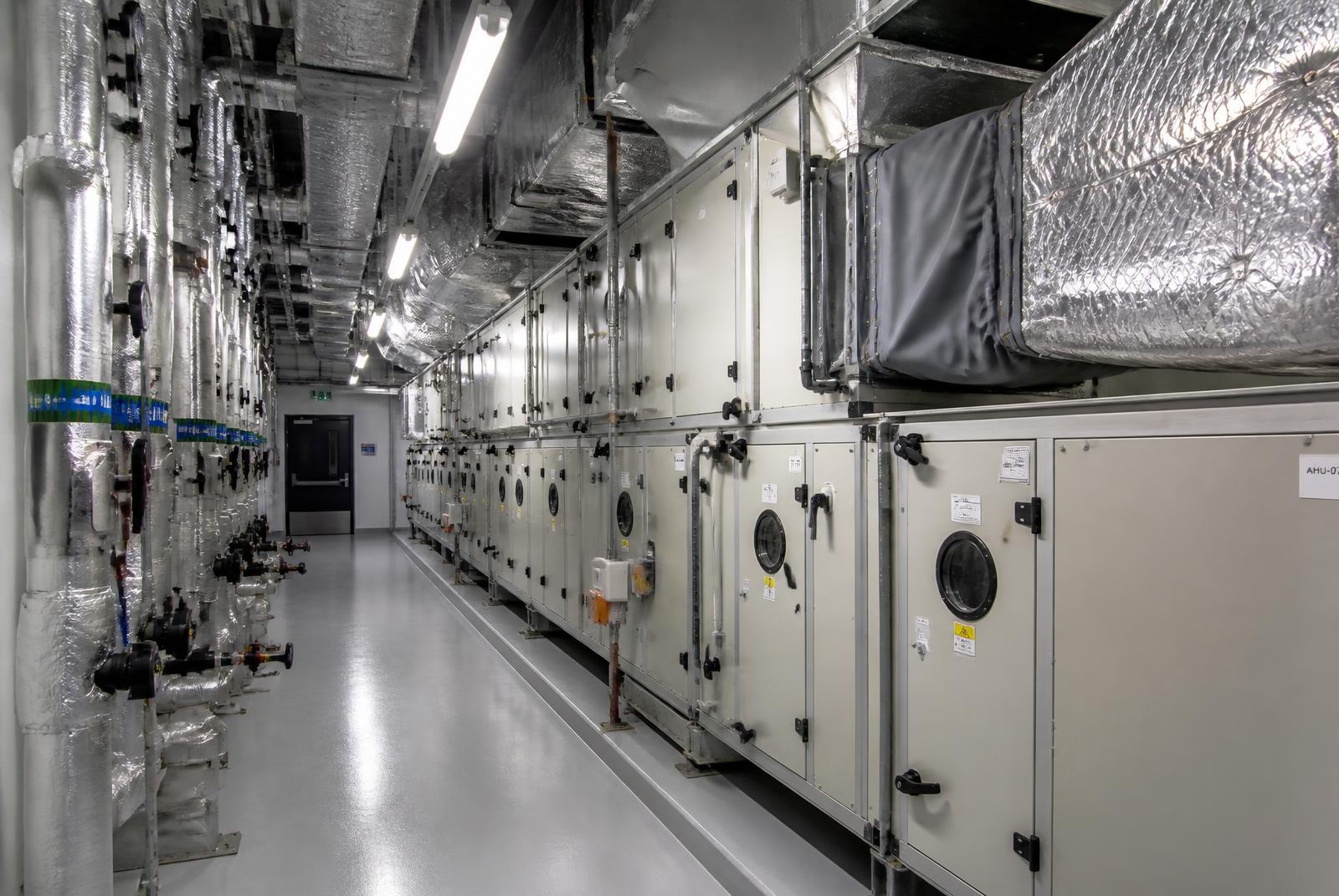 Commercial plant room with air handling units and insulated ductwork connections
